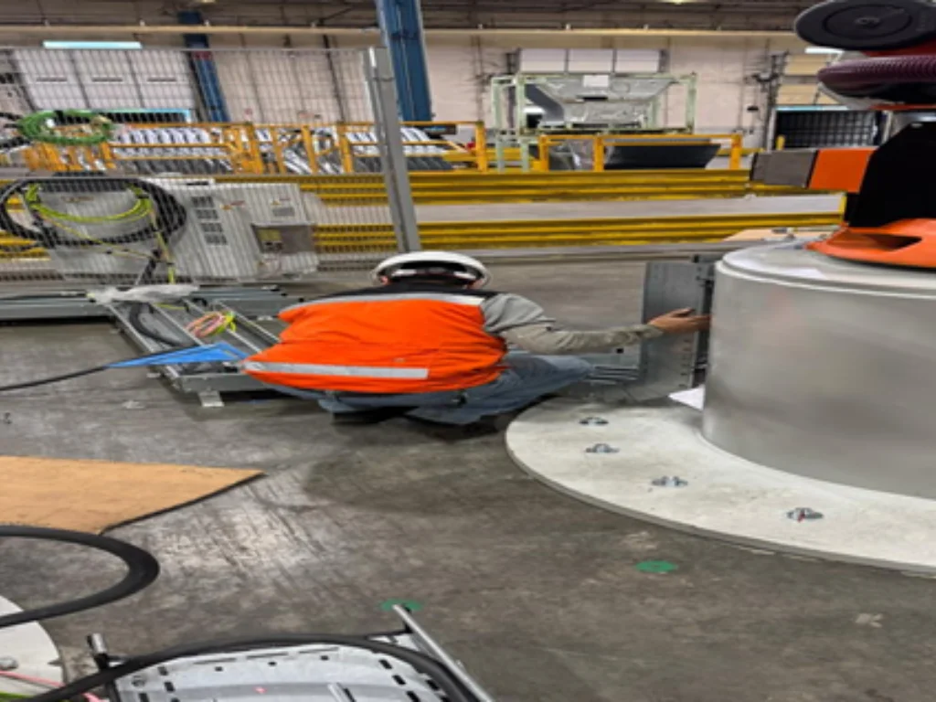 Electrical engineer supervising automation and wiring tasks in industrial facility