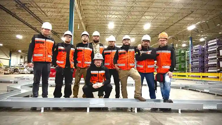 Technicians performing electrical and automation work on Tesla production line