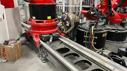 Technician performing maintenance on Tesla industrial robot